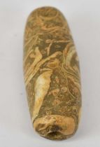 An ancient Persian hardstone bead, length 6cm.