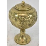 A Chinese style brass lidded pot, decorated with dragons, height 22cm.