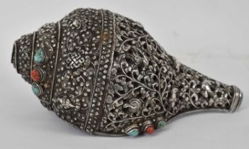 A Tibetan silver mounted conch shell set with semi-precious stones, 24cm.