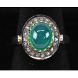 A cabochon green onyx and diamond halo ring set in silver, onyx 1.91ct.