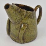 EWENNY POTTERY; a novelty green glazed jug modelled as a pig, inscribed and dated 1900 to base,