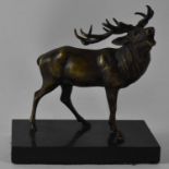 A bronze figure of a deer on black marble base, height approx 20cm. Condition Report: Please note