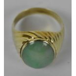 A 14ct yellow gold jade set ring, size U, approx. 7.1g.