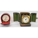 LOOPING; a Swiss cased miniature clock, together with a small brass French carriage clock (cased).