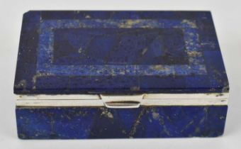 An early 20th century lapis lazuli rectangular trinket box with hallmarked silver mounts for