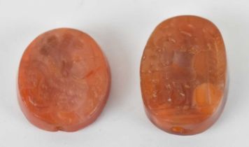 Two carved agate stones or seals with incised decoration, largest 2.5 x 2cm.