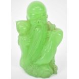 A green hardstone carving of Shou Lao, height 9.5cm.