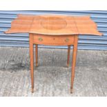 An Edwardian satinwood Pembroke table with butterfly top (possibly later), the base with end