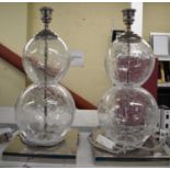PORTA ROMANA; a pair of large clear crystal table lamps, height 46cm.
