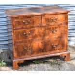 An Georgian walnut and crossbanded chest of two short and two long drawers on bracket feet, width