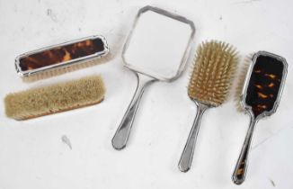 WILLIAM COMYNS & SONS LTD; a George VI hallmarked silver and tortoiseshell five piece dressing table