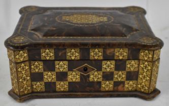 A decorative Spanish embossed and gilt tooled leather casket, width 22cm.