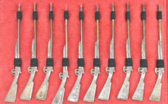 WILLIAM ASPREY; a set of ten modern hallmarked silver miniature rifles, in leather wallet and