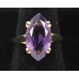A 9ct yellow gold ring set with large amethyst, size N.