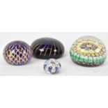 MURANO; four assorted paperweights.