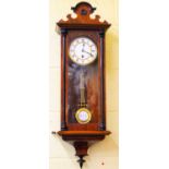 A Victorian spring driven wall clock of small proportions, height approx 80cm.