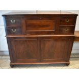 A large 19th century mahogany campaign style secretaire chest with central fall front flanked by two