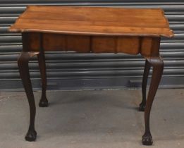 An early 20th century walnut centre table on cabriole legs, 94 x 58cm.