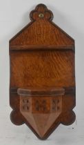 A late Victorian Gothic oak wall mounted shelf, height 36cm. Condition Report: This item appears
