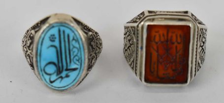 Two Islamic white metal rings.