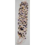 A collection of nine assorted semi-precious stone necklaces including amethyst etc.