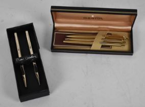 PIERRE CARDIN; two boxed pens and a set of three Paper Mate pens contained in a Sheaffer box.