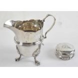 An Edward VII hallmarked silver cream jug, Birmingham 1905, height 9.5cm, together with a George V