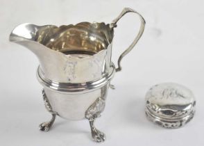 An Edward VII hallmarked silver cream jug, Birmingham 1905, height 9.5cm, together with a George V