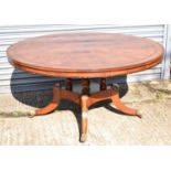 A large reproduction Regency style circular dining table with circular segmented and crossbanded