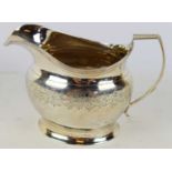 POSSIBLY ABRAHAM BARRIER; a George III hallmarked silver milk jug, London 1809, height 10cm, approx.