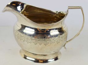 POSSIBLY ABRAHAM BARRIER; a George III hallmarked silver milk jug, London 1809, height 10cm, approx.