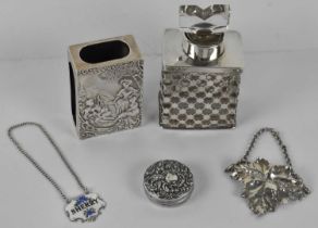 A glass scent bottle with hallmarked silver collar for 1912, a London hallmarked silver matchbox