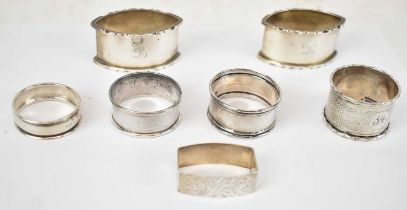 A pair of George V hallmarked silver napkin rings, Birmingham 1929, together with five other various