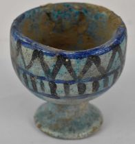 A possibly Ancient Egyptian turquoise decorated earthenware goblet, height 9.5cm.
