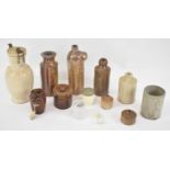 A collection of stoneware including bottles and flagons.