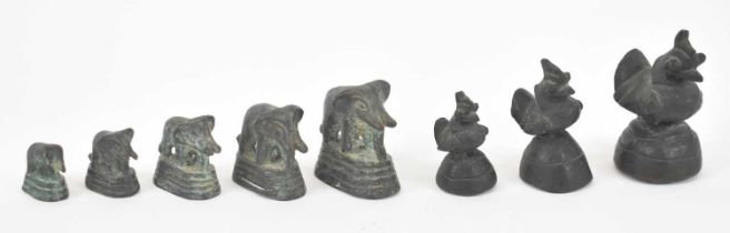 A group of African bronze weights comprising three graduated birds and five graduated elephants (8).