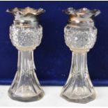 A pair of Edwardian Arts and Crafts style clear glass vases with hallmarked silver mounts, C E