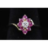 A 9ct yellow gold ruby and diamond dress ring.
