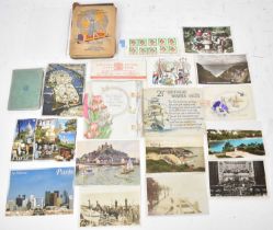 A quantity of 19th century and later postcards.