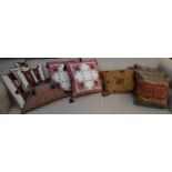 Six assorted Kilim decorated cushions and six further cushions.