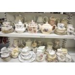 A quantity of part tea services and nine teapots, to include Aynsley etc.