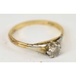 An 18ct yellow gold and platinum solitaire ring, size L/M, approx 2g.