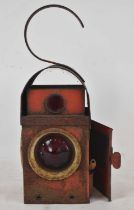 A red painted railway type lamp, height 41cm.
