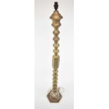 An Eastern style brass standard lamp, height to top of fitment 127cm.