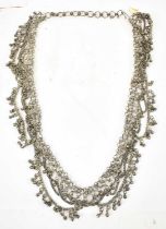 An Indian white metal sari belt, length approx. 90cm, approx. 269g.