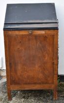 A rare early 20th century compositor's desk with sloping steel top above fifteen side drawers and