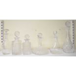 A group of six cut glass decanters, height of tallest 36cm.