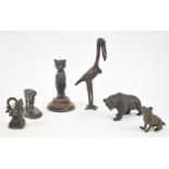 A group of bronze, spelter and metal animal figures including crane, pug dog, opium weight, buffalo,
