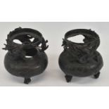 A pair of Japanese bronze dragon decorated vase surrounds, lacking liners, height 17cm.