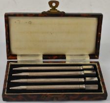 A cased set of four sterling silver propelling pencils, length 9cm.